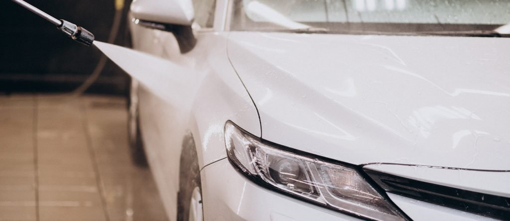 Is it okay to use a pressure washer to wash your car?